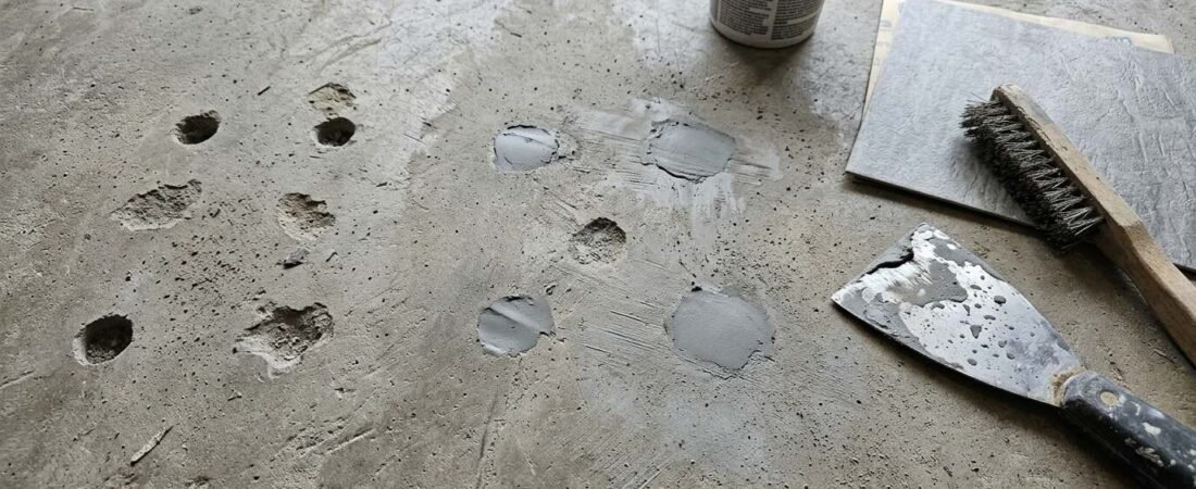 How to Fill Cracks and Holes in a Concrete Slab Before Peel and Stick Tile