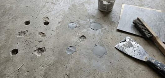 How to Fill Cracks and Holes in a Concrete Slab Before Peel and Stick Tile